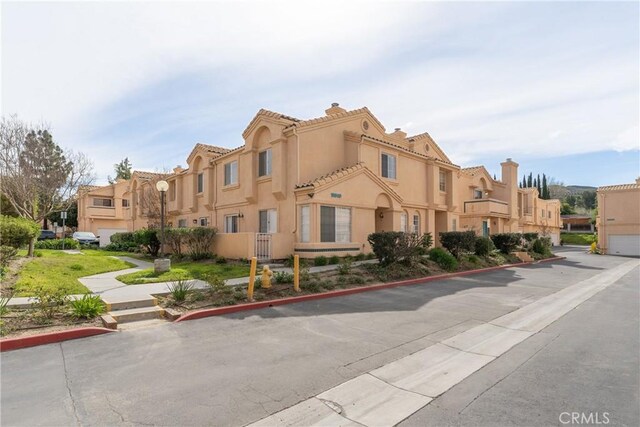 18840 Vista Del Canon Unit A, Newhall, CA 91321 - view of building exterior with a residential view