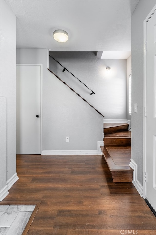 stairs with wood-type flooring