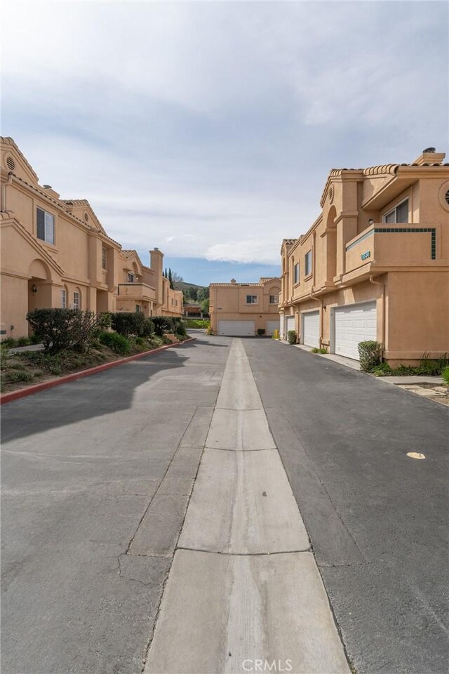 18840 Vista Del Canon Unit A, Newhall, CA 91321 - view of asphalt road featuring a residential view