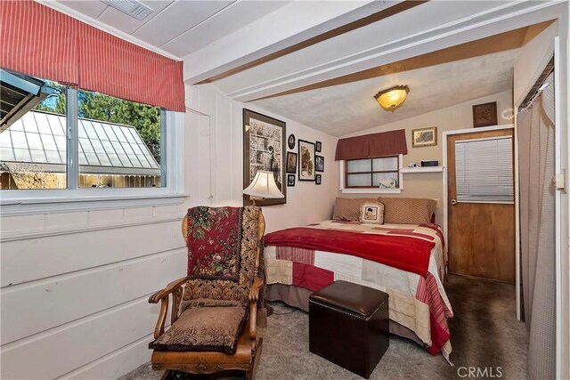 carpeted bedroom featuring vaulted ceiling with beams