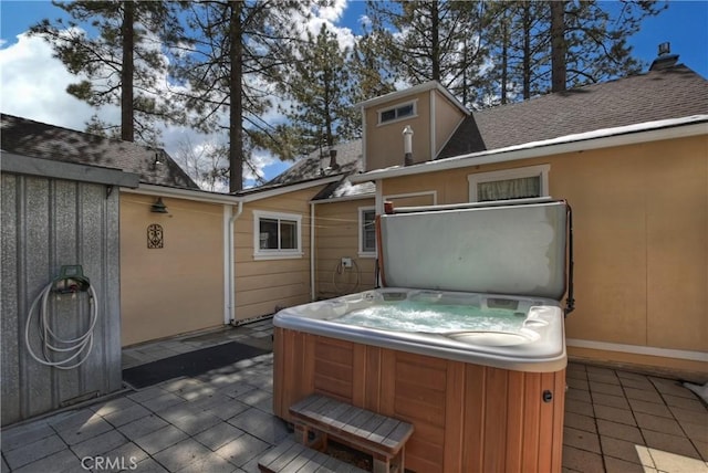 view of patio / terrace featuring a hot tub