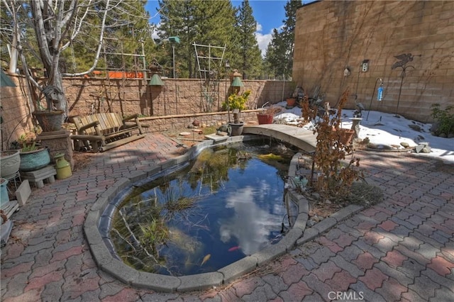 view of swimming pool with a fenced backyard