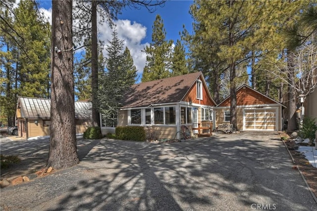 chalet / cabin with a garage