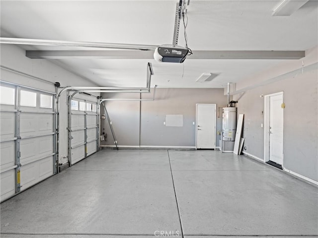 garage with strapped water heater and a garage door opener