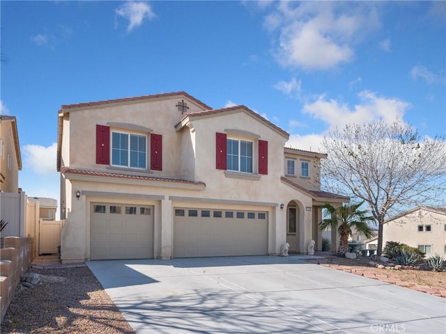 mediterranean / spanish house with a garage