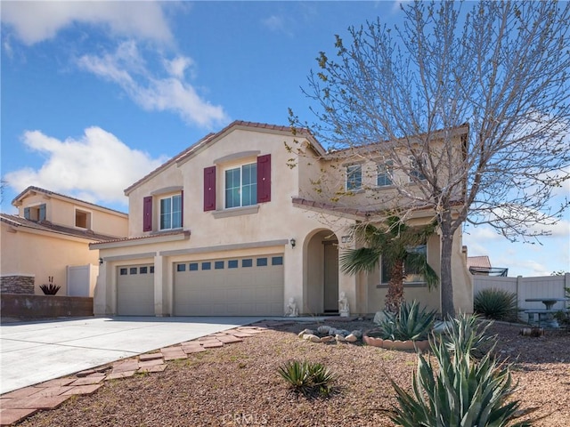 mediterranean / spanish-style home featuring a garage