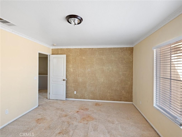 unfurnished room with light carpet and crown molding