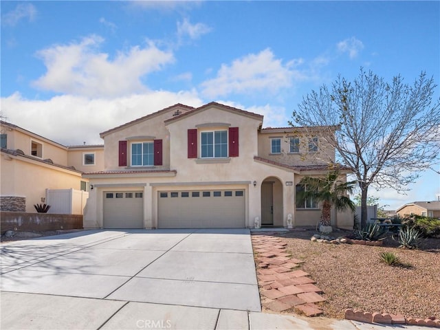 mediterranean / spanish house with a garage