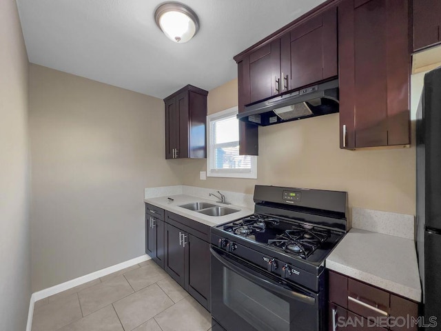 kitchen with black appliances, dark brown cabinetry, sink, and light tile patterned floors