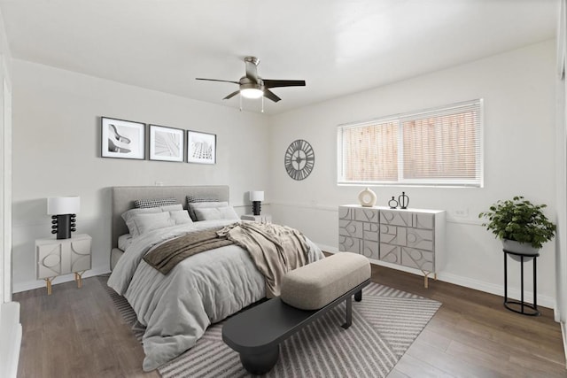 bedroom with hardwood / wood-style floors and ceiling fan