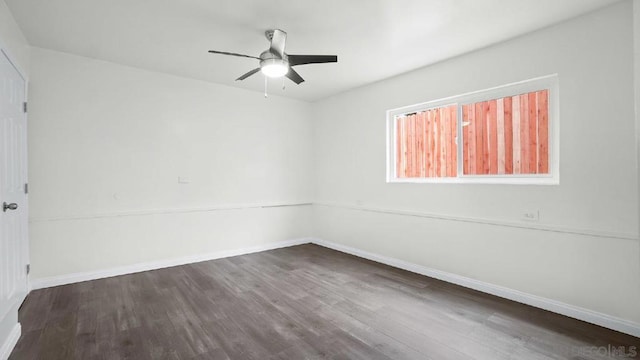 spare room featuring hardwood / wood-style floors and ceiling fan