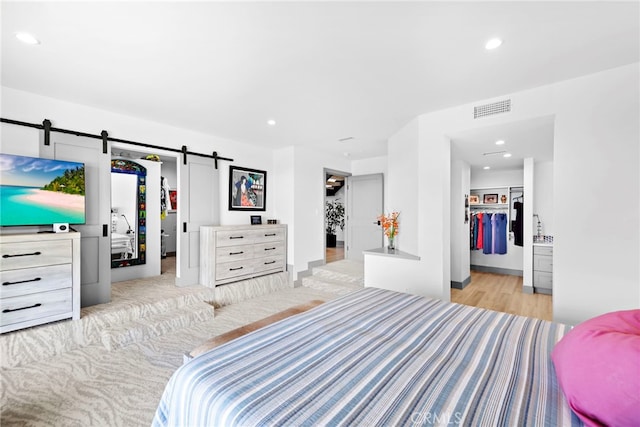 17 Monaco, Newport Beach, CA 92660 - bedroom with a spacious closet, a closet, light wood finished floors, and recessed lighting