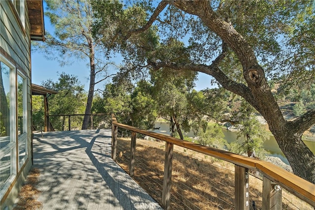 wooden deck featuring a water view