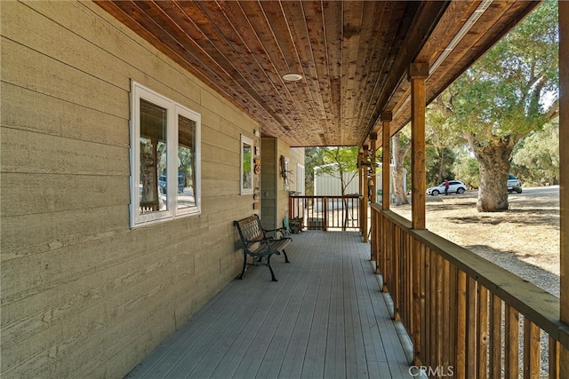 wooden terrace featuring a porch