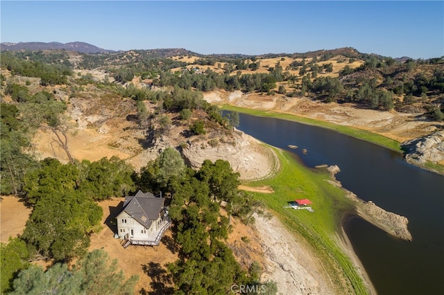 bird's eye view with a water and mountain view