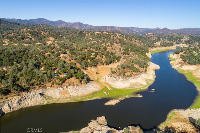 drone / aerial view with a water and mountain view