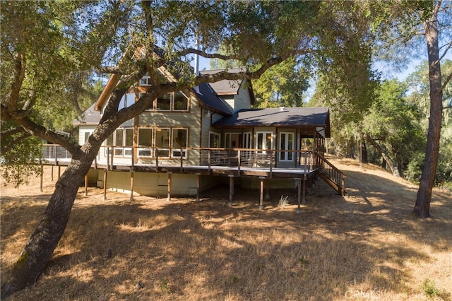 rear view of house featuring a deck