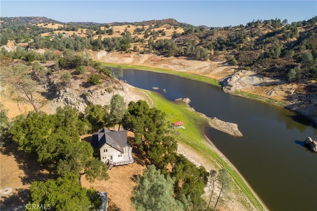 birds eye view of property featuring a water and mountain view
