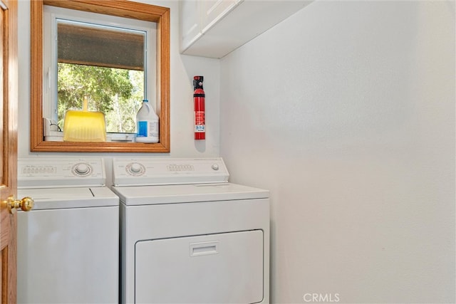 laundry area with cabinets and independent washer and dryer