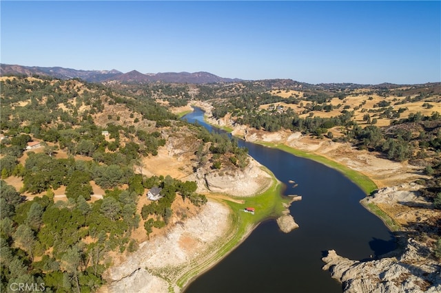 birds eye view of property featuring a water and mountain view