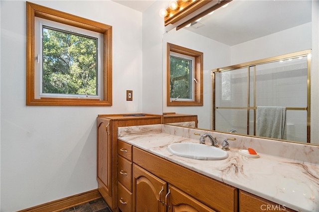 bathroom featuring vanity and walk in shower
