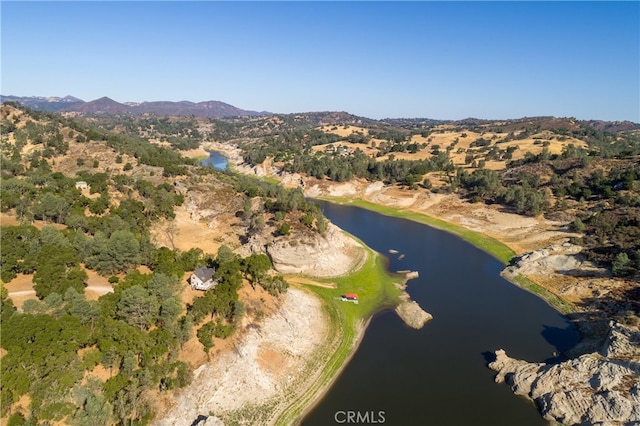 birds eye view of property with a water and mountain view