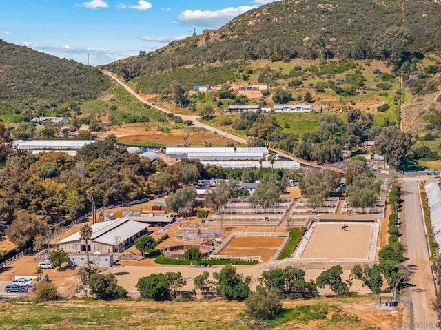 birds eye view of property with a mountain view