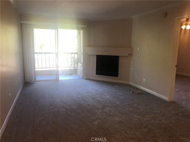 unfurnished living room featuring a fireplace, crown molding, and carpet