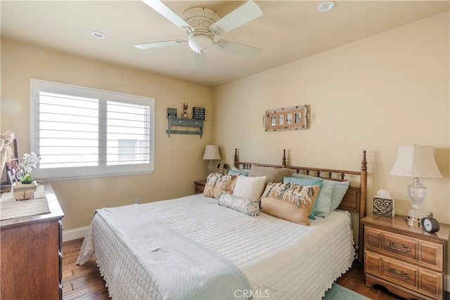 bedroom featuring ceiling fan and dark hardwood / wood-style flooring