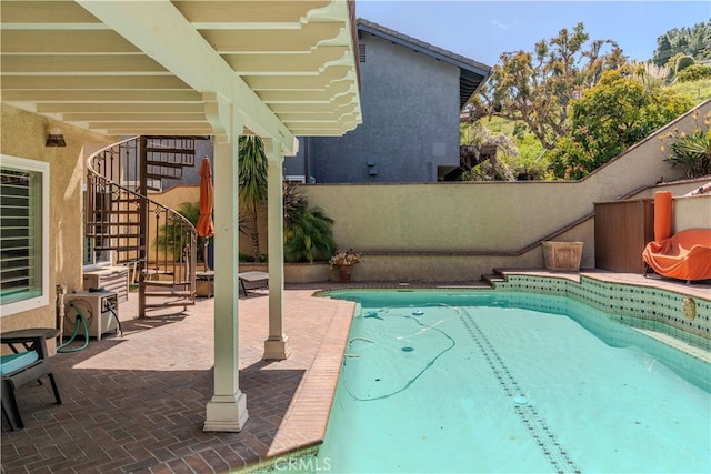 view of pool featuring a patio