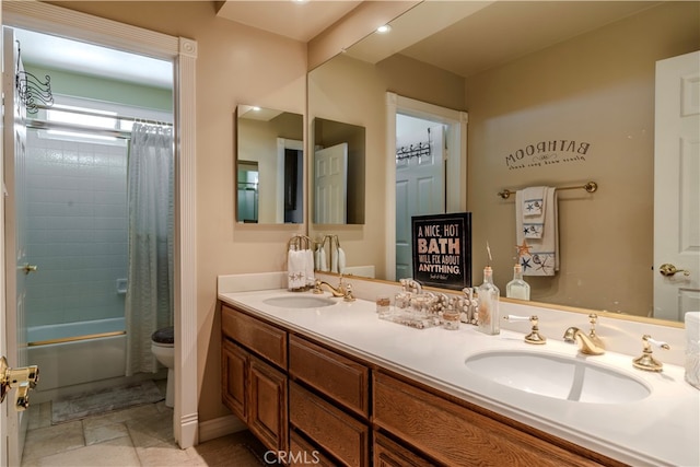 full bathroom with shower / tub combo with curtain, vanity, and toilet