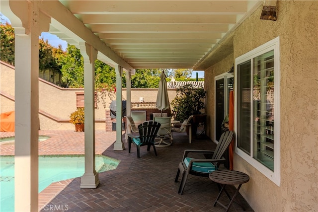 view of patio with a fenced in pool