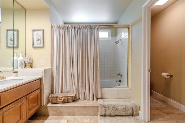 bathroom with shower / tub combo with curtain, vanity, and tile patterned flooring