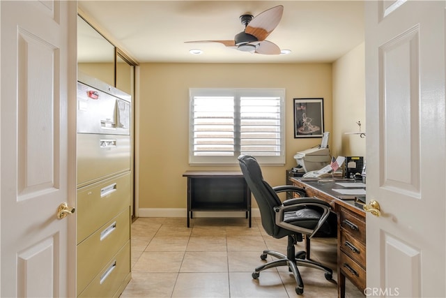 tiled office featuring ceiling fan