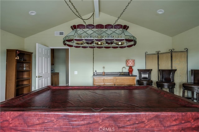 playroom with lofted ceiling with beams