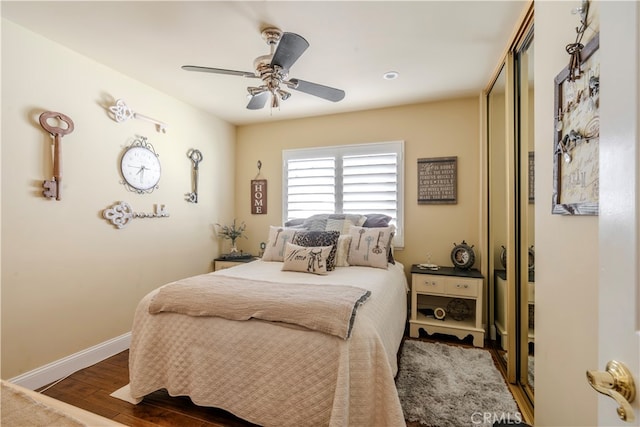 bedroom featuring ceiling fan and dark hardwood / wood-style floors