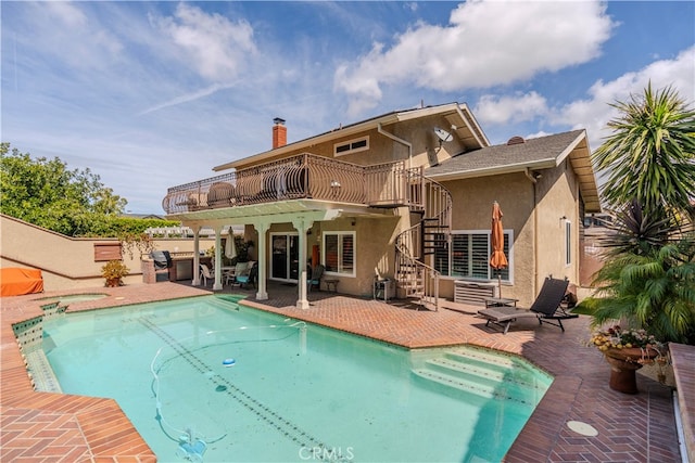 view of pool featuring a patio area