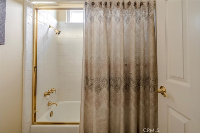 bathroom with shower / tub combo with curtain