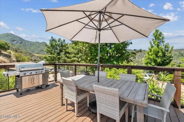 wooden terrace with a mountain view