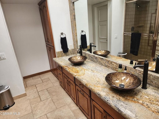 bathroom with an enclosed shower and vanity