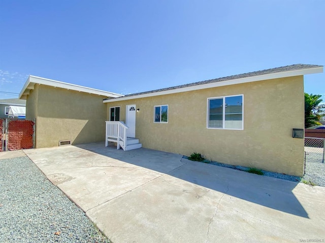 rear view of property with a patio area