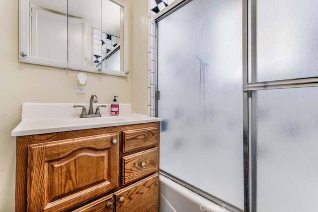 bathroom featuring vanity and enclosed tub / shower combo