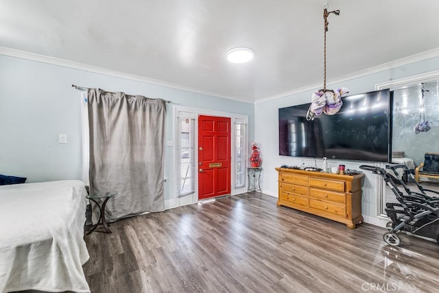 bedroom featuring hardwood / wood-style flooring and ornamental molding