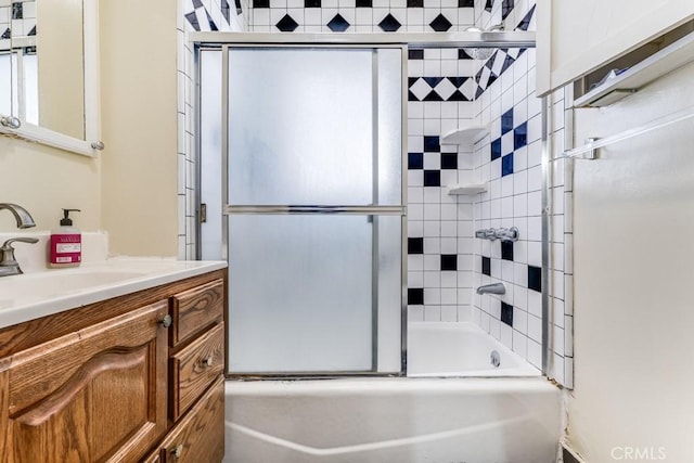 bathroom with vanity and enclosed tub / shower combo