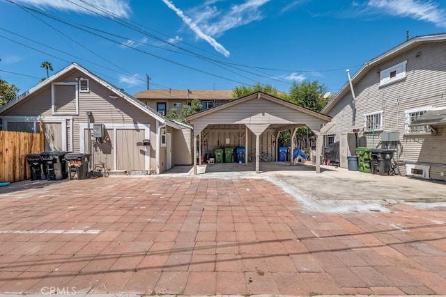 rear view of property featuring a carport