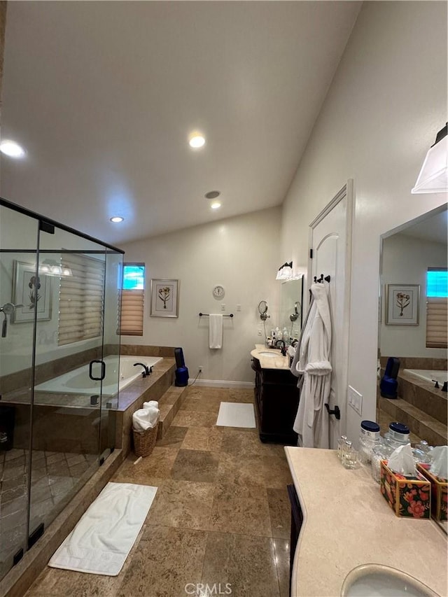 bathroom featuring independent shower and bath and vanity