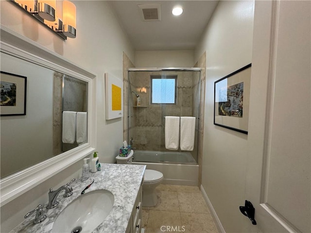 full bathroom with toilet, tile patterned flooring, vanity, and shower / bath combination with glass door