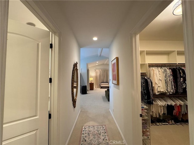 corridor featuring light colored carpet