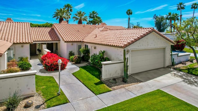 view of front of house with a garage and a front lawn