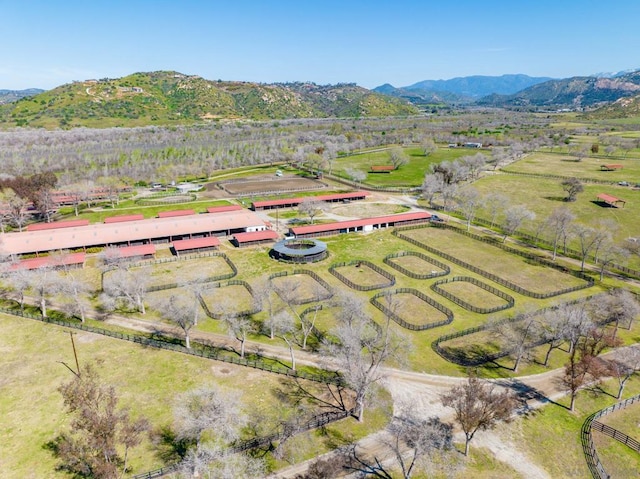 drone / aerial view featuring a rural view and a mountain view